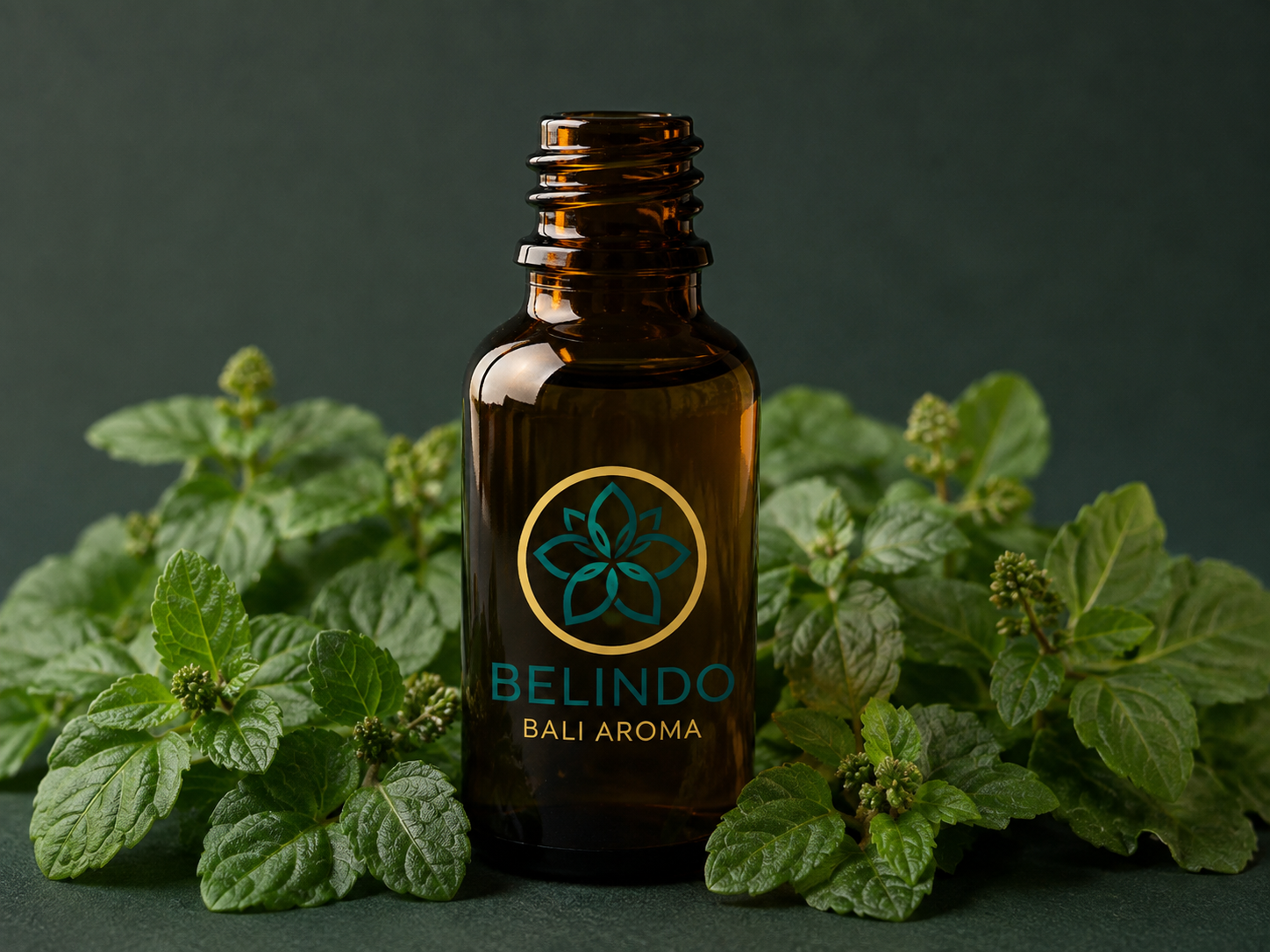Amber patchouli oil bottle with dried patchouli leaves